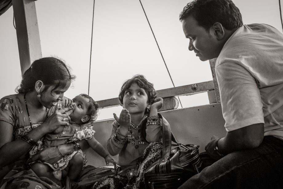 Family on the Ferry from Gharapuri